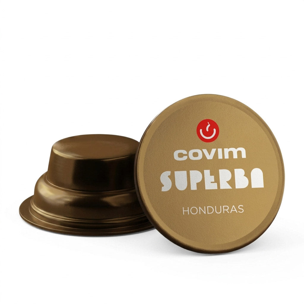 Dettaglio di due capsule Covim Superba Honduras: entrambe caratterizzate da corpo e pellicola di colore bronzo metallizzato, con una vista di profilo e l'altra dall'alto.